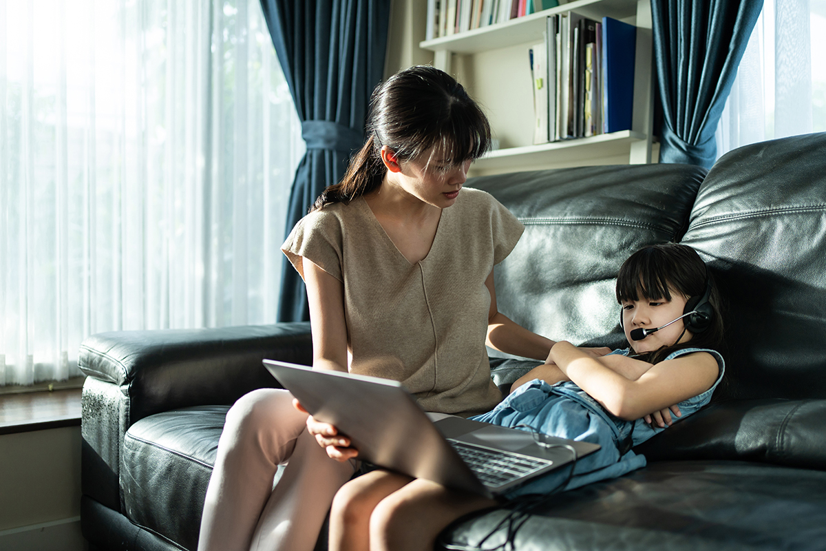 Asian mom motivate young girl student daughter to learn online a